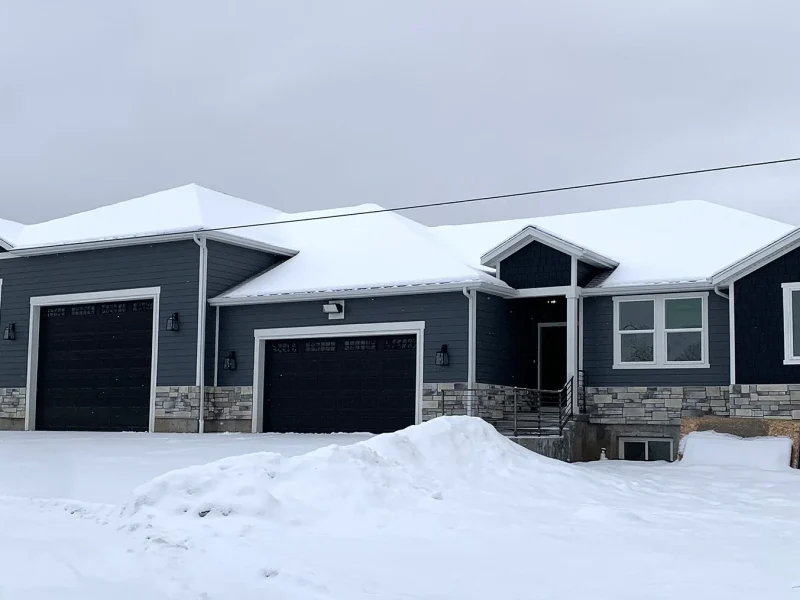 Custom Blue-Siding Rambler with 3-Car Garage