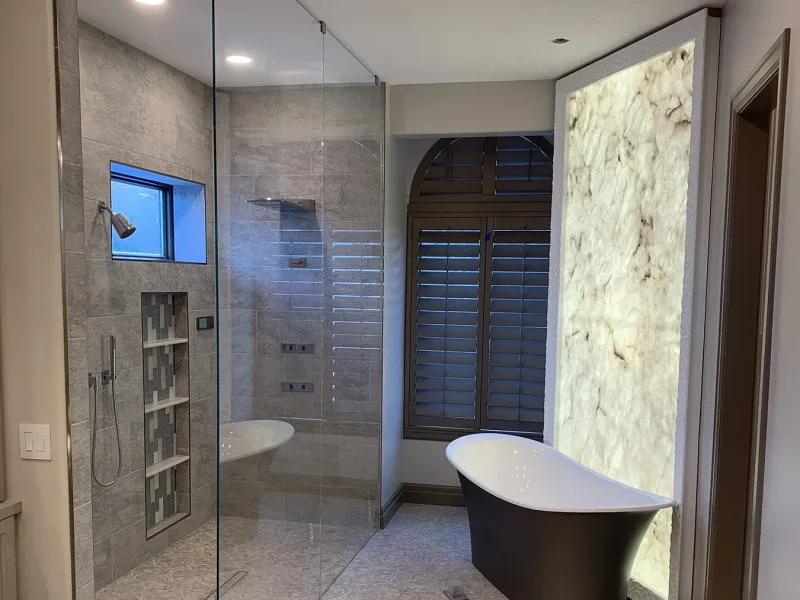 Backlit Onyx Master Bath with Freestanding Tub