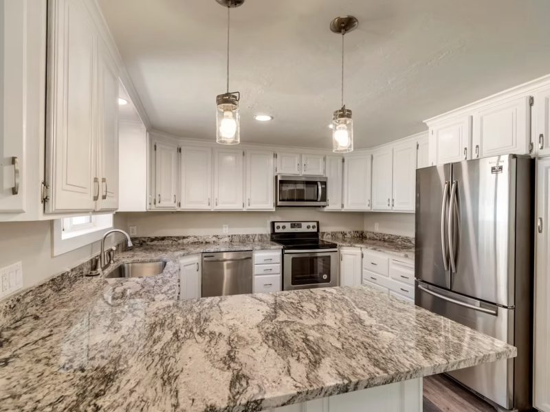 White Cabinet & Granite Peninsula Kitchen