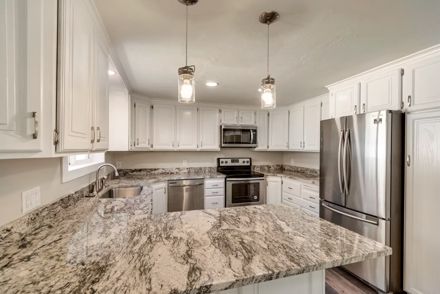 White Cabinet & Granite Peninsula Kitchen