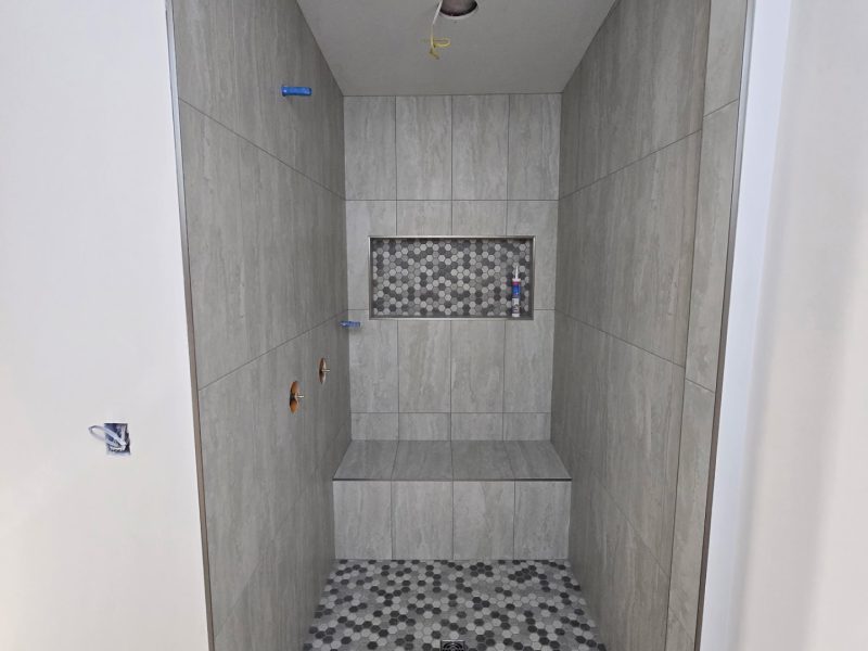 Gray Stone-Look Walk-In Shower with Hex Mosaic