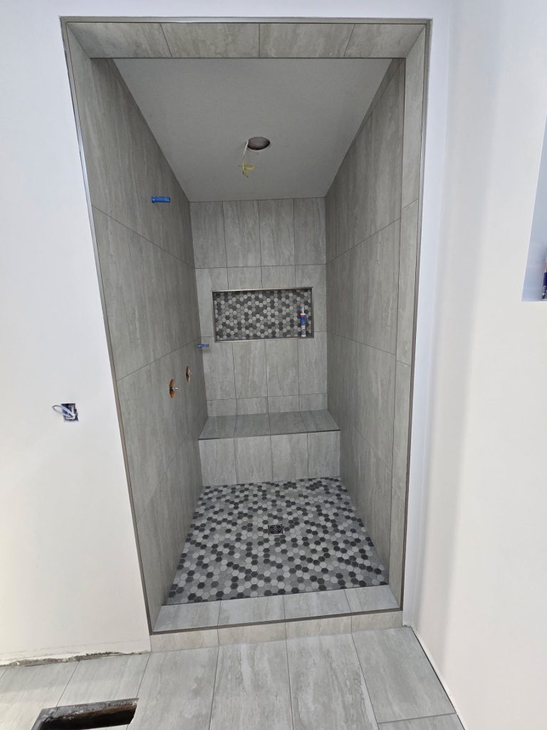 Gray Stone-Look Walk-In Shower with Hex Mosaic photo 2